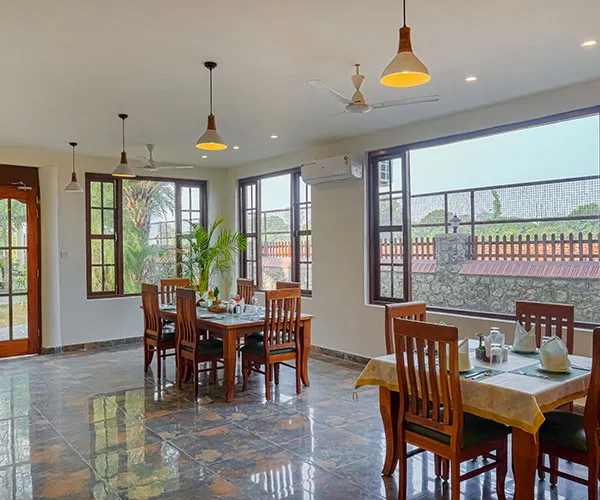 Indoor dining area set for guests - Manovan Resort